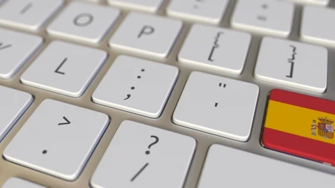 Key with flag of Spain on the computer keyboard switches to key with flag of Stock Footage 109210463