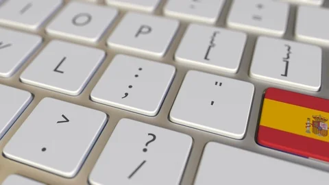 Key with flag of Spain on the computer keyboard switches to key with flag of Stock Footage 109278944