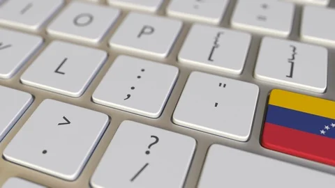 Key with flag of Venezuela on the computer keyboard switches to key with flag of Stock Footage 109451141