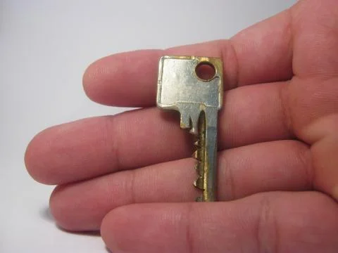 A key in a hand  Fotos Stock