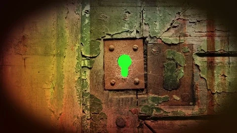Key hole in  metal  door  and  green screen from outside. Zoom in. Stock Footage