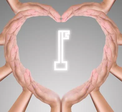 Key icon in hand heart Stock Photos