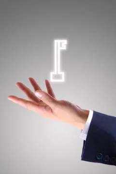 Key icon on hand Stock Photos