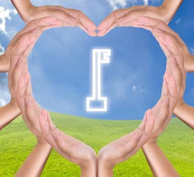 Key icon in hands heart Stock Photos