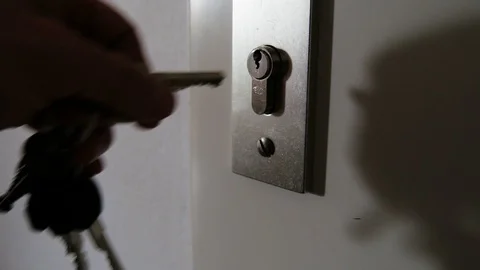 Key inserted in the door lock Stock Footage 88388129