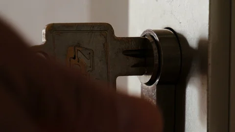 Key inserted in the door lock Stock Footage 88388290