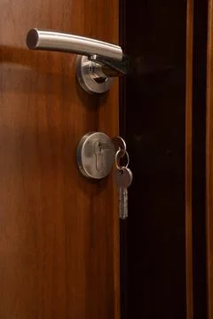 Key inserted into door lock Stock Photos