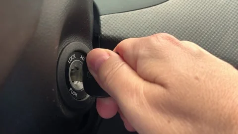 Key inserted into the lock of ignition of the car Stock Footage 246036646