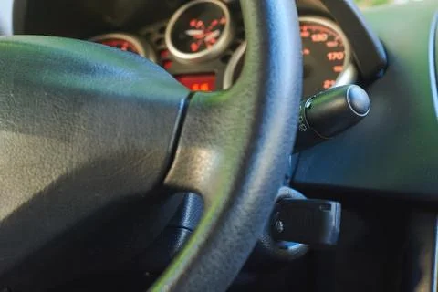 Key inserted into the lock of ignition of the car. 스톡 사진