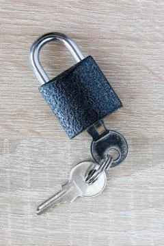 The key is inserted in the padlock. Stock Photos