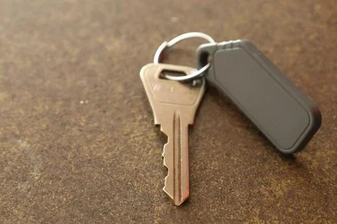 Key with keychain on the table Fotos de archivo