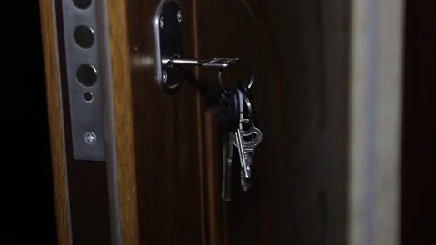 Key in keyhole on door Stock Footage 73701388