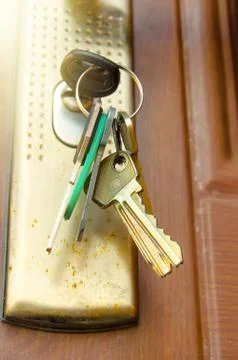 Key in keyhole Stock Photos