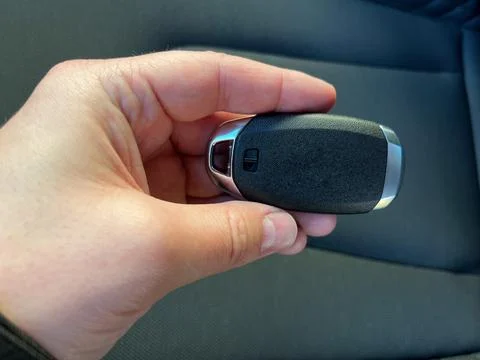 The key with keyless access to the car is black Stock Photos