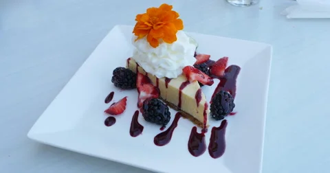 Key Lime Pie Dessert with Wipe Cream with Fruit Sauce on Plate, 4K Stock Footage 68822423