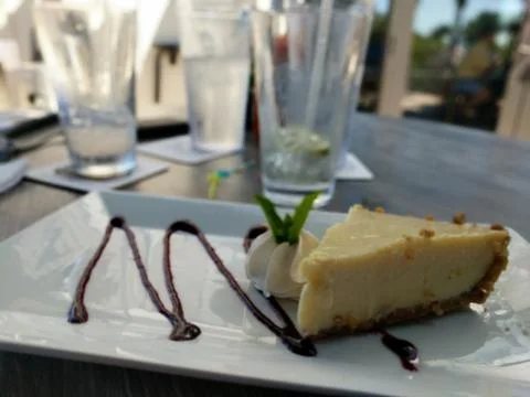 Key Lime Pie with Empty Glasses Stock Photos