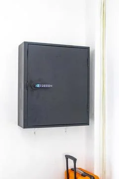 Key lock box with pin code mounted on hotel lobby wall Thailand. Stock Photos