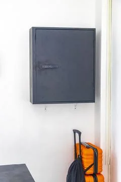 Key lock box with pin code mounted on hotel lobby wall Thailand. Stock Photos