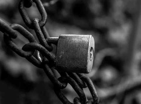 Key lock protecting something with chains Stock Photos