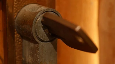 Key in the lock rotates and door opens to bright space Stock Footage 72653735