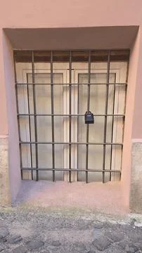 Key lockbox on barred window Stock Photos