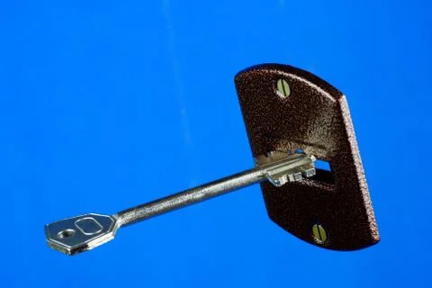 The key opens the lock, on a blue background. Stock Photos