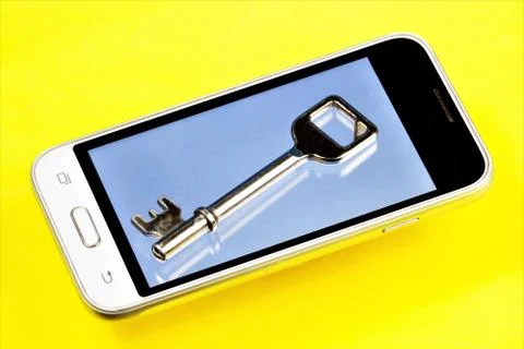 Key on the phone screen. Stock Photos
