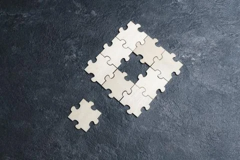 A key piece of a puzzle is missing. Stock Photos