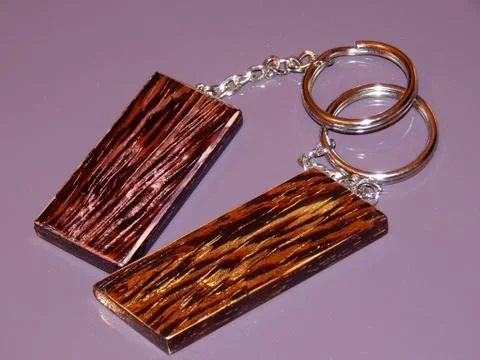 The key ring is made from precious Wenge wood. Handmade Stock Photos