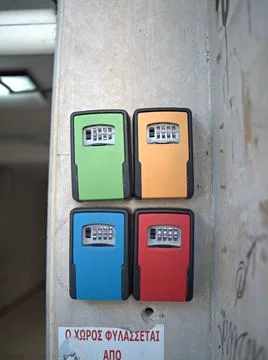 Key safe boxes mounted on a concrete wall Stock Photos