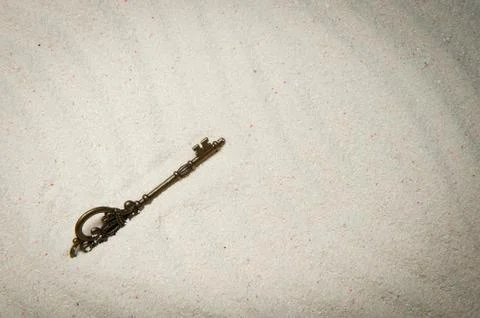 Key on sand Stock Photos