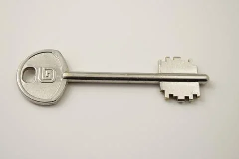 The key is silver on a white background Stock Photos