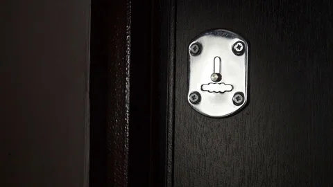 Key sliding into lock and locking\ unlocking door. Close-up. Stock Footage 70400595