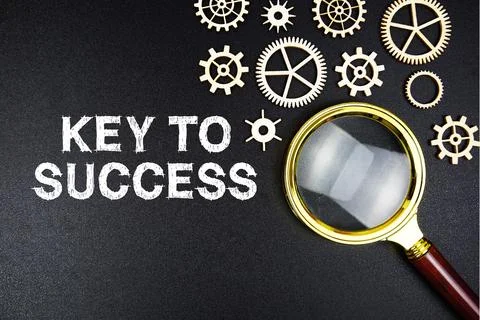 Key To Success text message with magnifying glass on black background Stock Photos