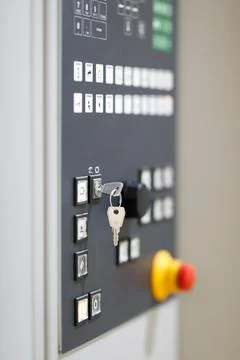 Key switch on control panel of industrial machine Foto stock