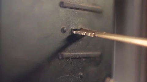 Key is turned in the keyhole close to Stock Footage 62810822