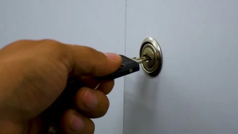 Key Turning in Lock, Inserting and Turning a Key, Close-Up of Key Rotating in Stock Footage 312007021