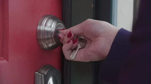 Key unlocking door knob, opening door Stock Footage 139719708