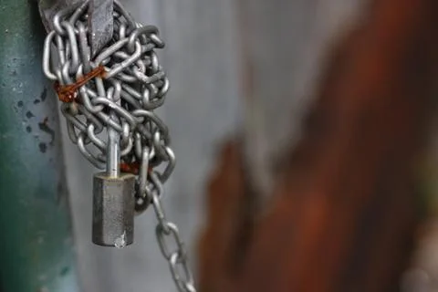 Key on the wall and chain Stock Photos