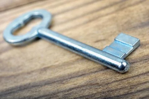 Key on wooden table Stock Photos