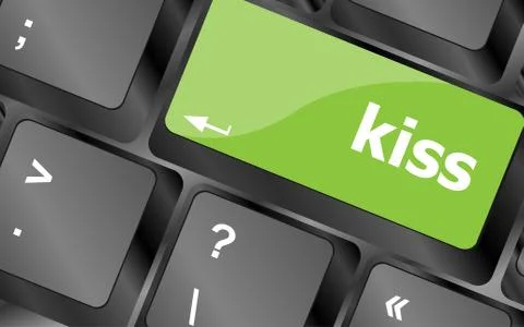 Key with the word kiss on it, on a computer keyboard. Laptop button Stock Illustration