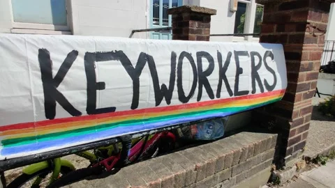 KEY WORKERS RAINBOW - FRIENDLY SIGN LEFT DURING COVID-19 LOCKDOWN 4K Stock Footage 131049660