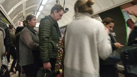 KEY WORKERS STANDING ON PLATFORM OXFORD CIRCUS TUBE STATION LONDON Stock Footage 126590071