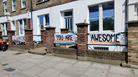 KEY WORKERS YOU ARE AWESOME - RESIDENTS PUT SIGN OUT DURING COVID-19 LOCKDOWN 4K Stock Footage 131049606