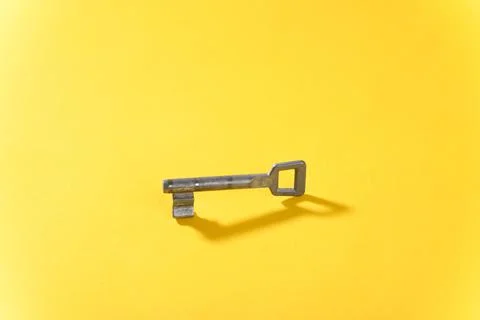 Key on yellow background close up. 스톡 사진