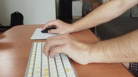 Keyboard and computer mouse on table in hands of caucasian man. Stock Footage 330541842