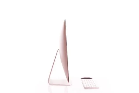 Keyboard and computer screen on a white table with reflection on white backgr Stock Photos
