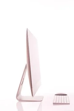 Keyboard and computer screen on a white table with reflection on white backgr Stock Photos