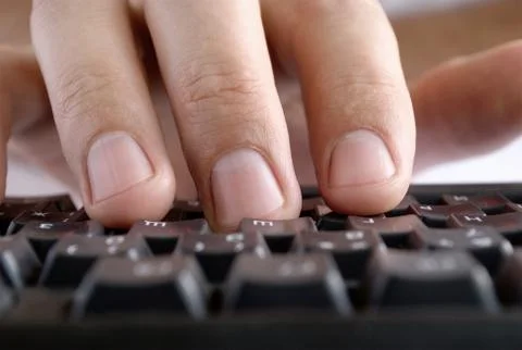 Keyboard and hand Stock Photos