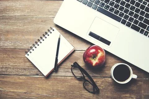 Keyboard and notepad on table Stock Photos